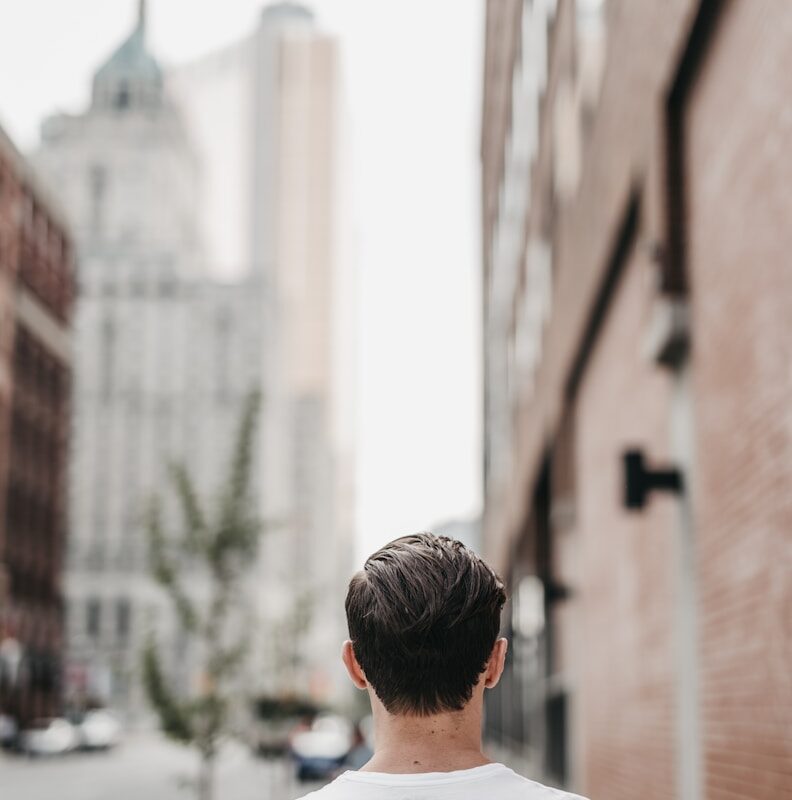 man walking on street